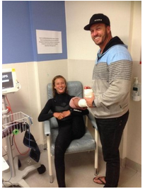 Kiarra and her father Jamie after she was treated at the hospital.  Photo credit: Emma Simkin