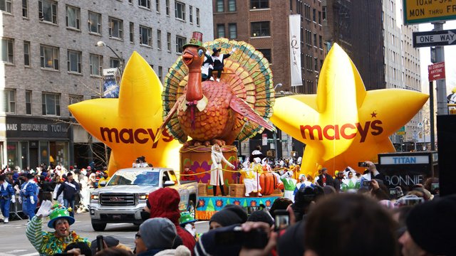 Macys Thanksgiving Day Parade featuring the float of Tom the Turkey and Macys Yellow Stars.