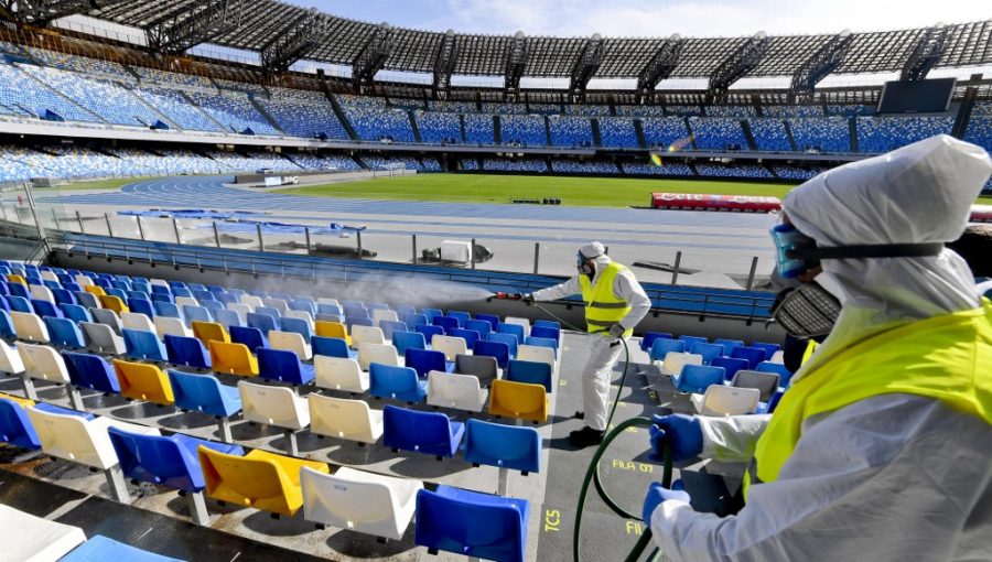 (FILES) In this file photo taken on March 04, 2020 Picture taken on March 4, 2020 shows cleaners wearing a protective suit, as they sanitise the seats of the San Paolo stadium in Naples. - Hiring is surging and wages are rising in the United States as the year begins, but the coronavirus is poised to infect the economy and hamper President Donald Trump's re-election bid.
Wall Street has tumbled in recent days as the outbreak spread and undermined the view that the US economy is inoculated against the danger.
The White House has tried to downplay the impact, and Trump on march 6, 2020 even made the extraordinary claim that US businesses are benefitting from people staying in the country while predicting stocks would bounce back. (Photo by CIRO FUSCO / ANSA / AFP) / - Italy OUT