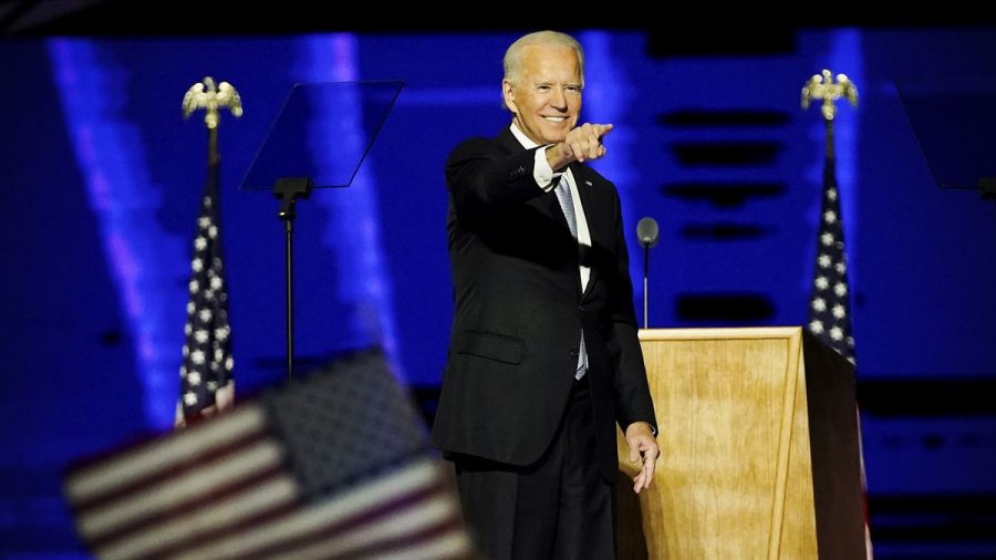 President-elect Joe Biden (pictured) delivers his victory address from Wilmington, Delaware. In a historic victory over incumbent president Donald Trump, Biden won  the largest popular vote count ever in an election with sky-high turnout on both sides. Rather than a revolutionary beginning to a new era, Bidens win seems to signal more of a return to normalcy, an end of an era rather than the dawn of a new one. Photo credit: Andrew Harnik/AFP/Getty Images