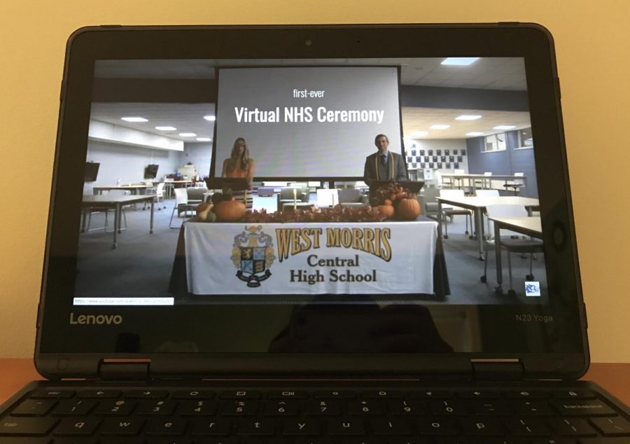 NHS advisors Mrs. Donlon and Mr. Cinotti introduce this years Induction Ceremony, viewed on a school Chromebook.