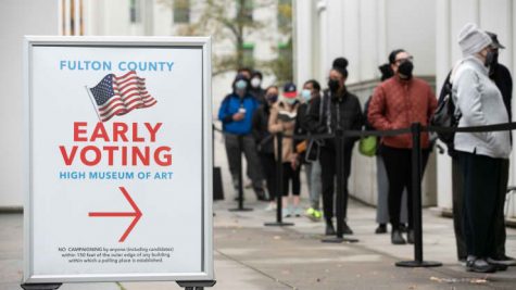 Voters line up for the first day of early voting outside of the High Museum polling station on December 14, 2020 in Atlanta, Georgia. Georgians are headed to the polls to vote in a run off election for two U.S. Senate seats.
