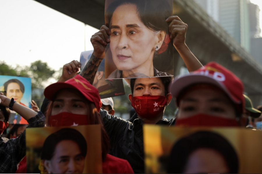Protesters+hold+up+photos+of+State+Counselor+Aung+San+Suu+Kyi%2C+de+facto+leader+of+Myanmar%2C+at+the+embassy+in+neighboring+Thailand.+In+a+bloodless+coup%2C+the+military+of+Myanmar%E2%80%94the+Tatmadaw%E2%80%94overthrew+Aung+San+Suu+Kyi+and+the+civilian+government+following+a+decisive+loss+in+the+national+elections%2C+which+it+declared+fraudulent.+The+events+represent+a+culmination+of+Myanmar%E2%80%99s+fall+from+grace+over+the+past+few+years%3B+formerly+welcomed+as+a+democratic+experiment%2C+the+country+has+since+been+plagued+by+ethnic+conflict+with+a+systematic+genocide+against+its+Rohingya+minority.+Photo+credits%3A+Lauren+DeCicca%2FGetty+Images.%0A