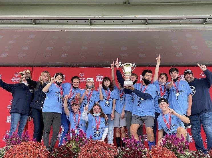 West Morris Unified soccer team hoists the 2021 Unified Cup. 