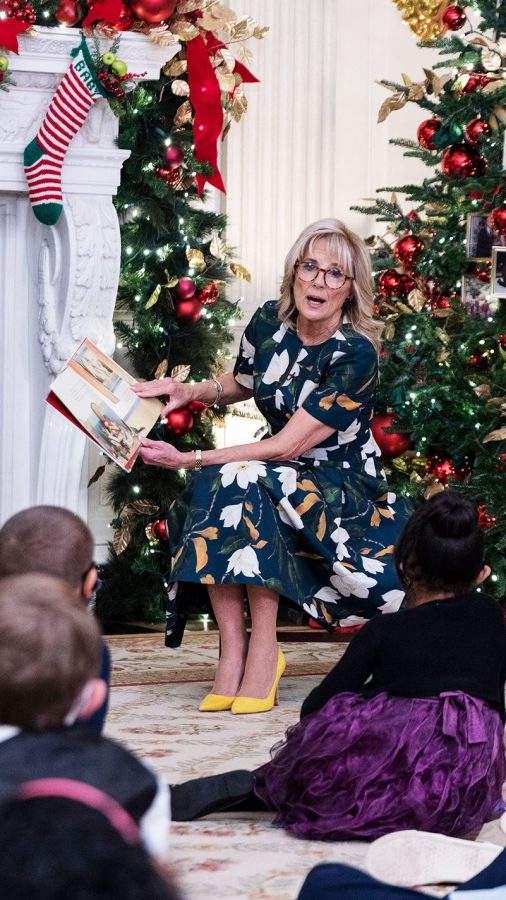 First Lady Dr. Jill Biden reads a story to children in the State Dining Room.