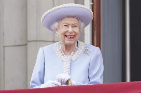 Queen Elizabeth smiled while overlooking a crown at Buckingham Palace for her Platinum Jubilee .  