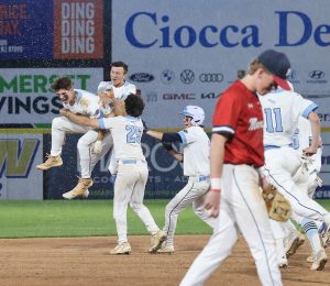 The team rushes the field to celebrate Matt Healys walkoff hit (Jen Sheppard).