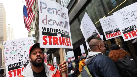 The Writers Guild of America on strike in NYC in front of the Peacock NewFront on May 2, 2023.