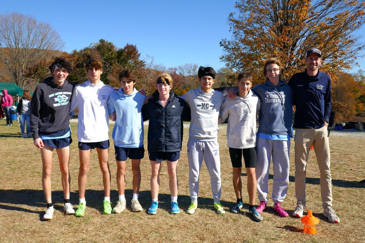 Lucas Rowland, Adriano Passaro, Bryan Dillion, Xavier Buoye, Ryan Faulkner, Lukas Wolinski and Coach Christopher Johnson celebrate together after a great day at sectionals. The Pack placed 5th in the championship. 