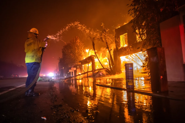 L.A Firefighter combats the flames in one of numerous California wildfires. 