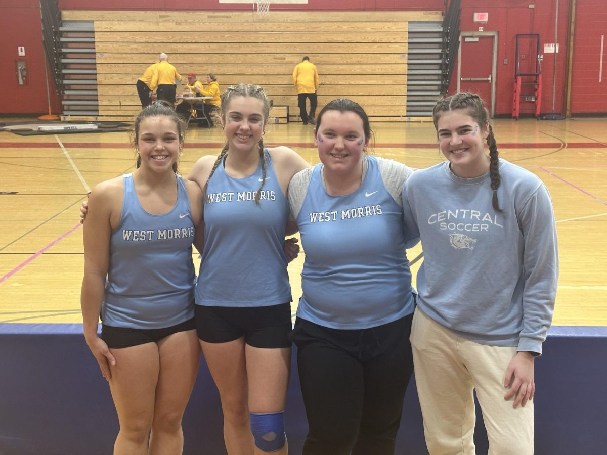 Hailey Banning (second to left), accompanied by her 2024-2025 girls Winter Track and Field throwing team. 