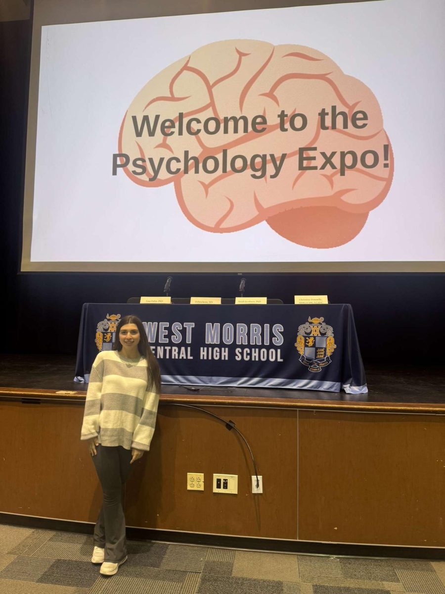 Elisa Castro poses for a picture at the Psychology Expo that she held in Centrals Auditorium. She was extremely happy to have completed her Gold Award.  "It's an accomplishment and something I'm proud of, now that I've actually done it," said Castro.