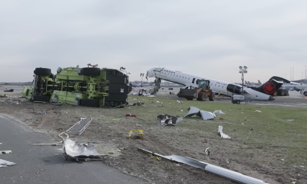 The scene of the collision between an Air Canada Express plane and a fire truck at LaGuardia airport during the investigation by the NTSB.
